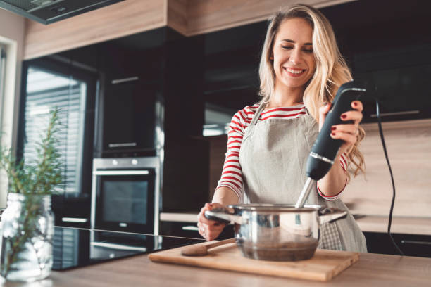 istock A woman blending soup in a modern kitchen 1142495570