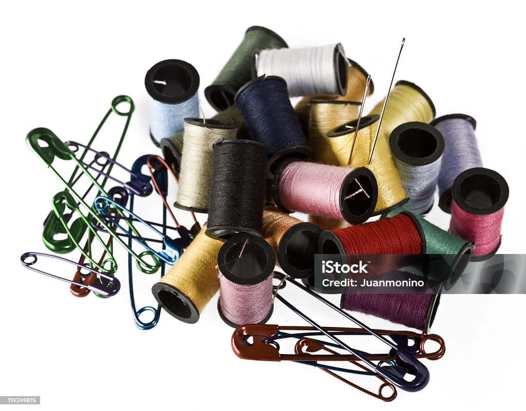 Threads, needles and safety pins  Arrangement Stock Photo