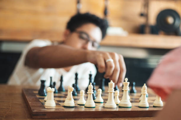 schachspielen - concentration chess playing playful stock-fotos und bilder