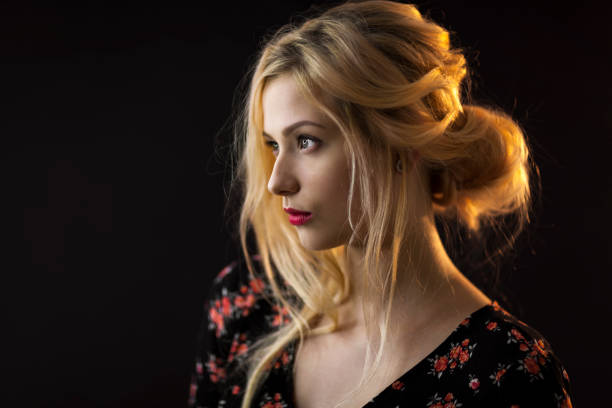 istock Beautiful Young Blond Woman On Black Background 1142510671