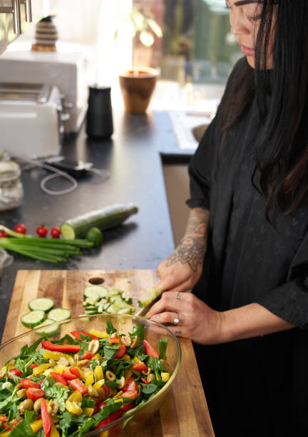 istock Woman Preparing a Salad 1142510706