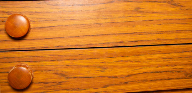 istock Wooden pull-out drawers with round wooden handles. 1142510739