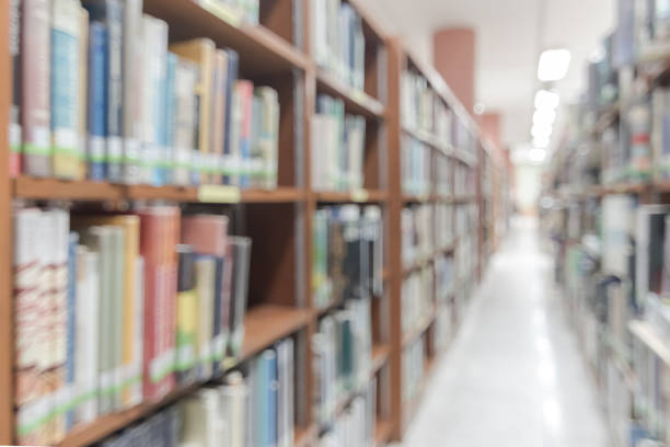 istock Blur school library or study room with book shelves for education background 1142513475