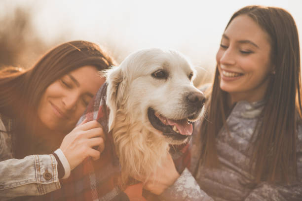 istock Happy women hugging the dog 1142514459