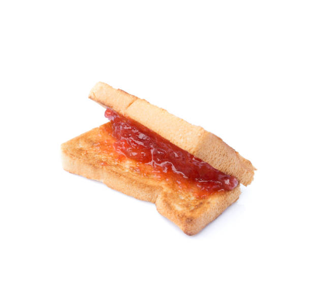 istock slide bread with strawberry jam isolated on white background 1142514491