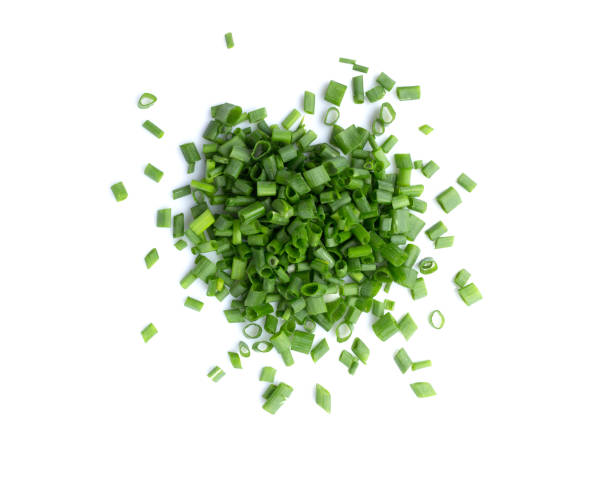 istock Chopped green onions or scallions placed on white background 1142514518