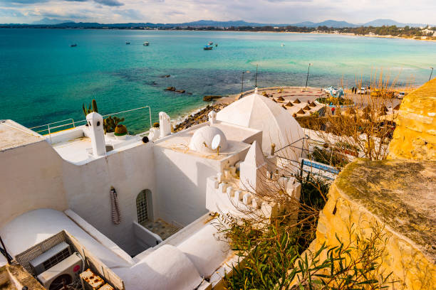 Hammamet, Tunisia. Image of architecture of old medina Hammamet, Tunisia. Image of architecture of old medina with dramatic sky at sunset time. tunisia beach stock pictures, royalty-free photos & images