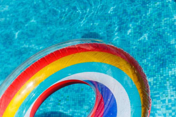 istock Inflatable water activities circles tuba float on the water in the pool. Concept, fun, perky summer and relaxation. 1142515594