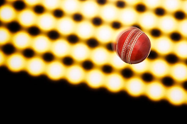 istock Cricket ball mid air against floodlights 114251734
