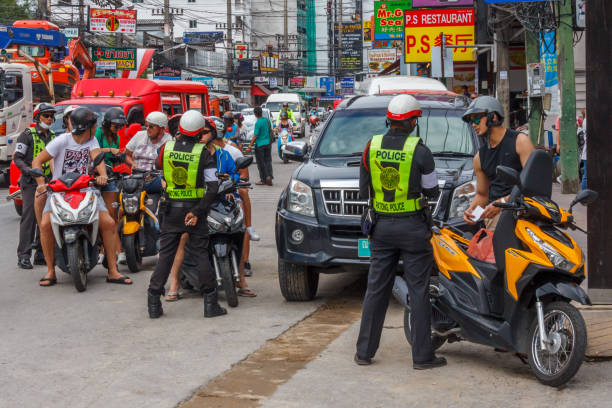 Police checking tourist driving licenses Phuket, Thailand-6th January 2017: Police checking tourist driving licenses. Th police target foreigners and issue fines. puket stock pictures, royalty-free photos & images