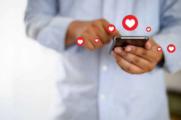 istock man use Social media,social network  phone message from lovers. Send a message love 1142526058