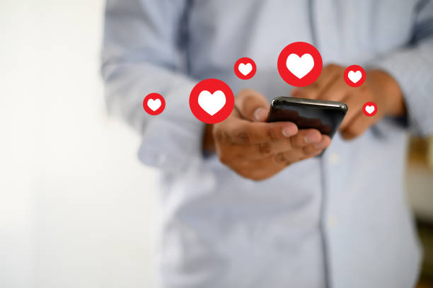 istock man use Social media,social network  phone message from lovers. Send a message love 1142526063