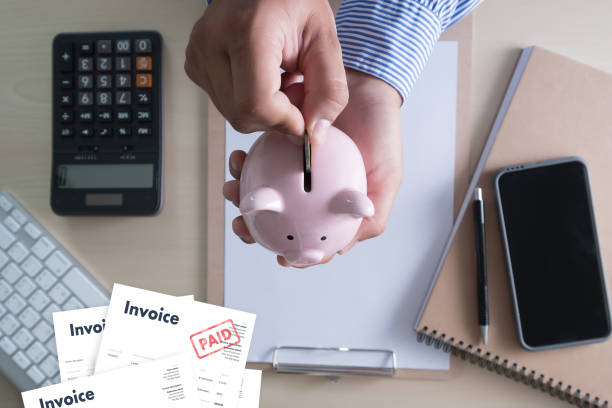 istock Close-up man work Invoice Bill Paid Payment  At Office Invoice savings, finances bill 1142526094