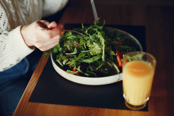 istock Beautiful girl sitting in a cafe 1142527499