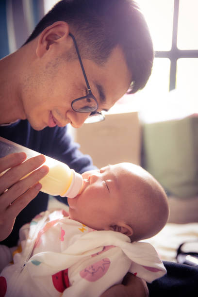 istock Dad feeding his baby 1142530758