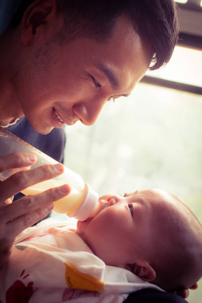 istock Dad feeding his baby 1142531528