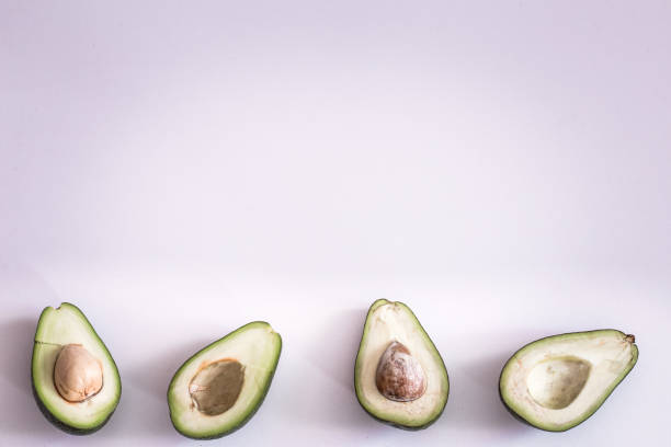 istock the broken halves of avocado on a light background 1142532791