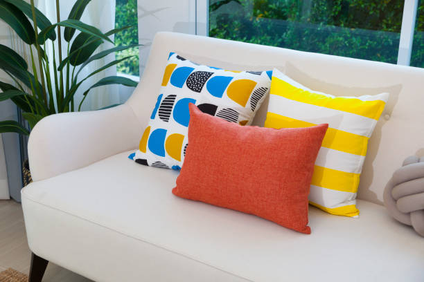 istock Colorful pillows on a sofa in modern living room. 1142537215