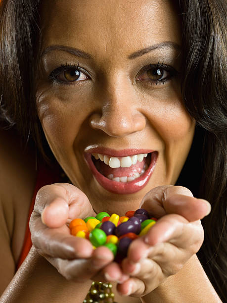 Colorful candy on yellow background