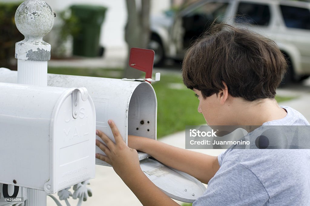 Child with his hand inside a mailbox  Child Stock Photo