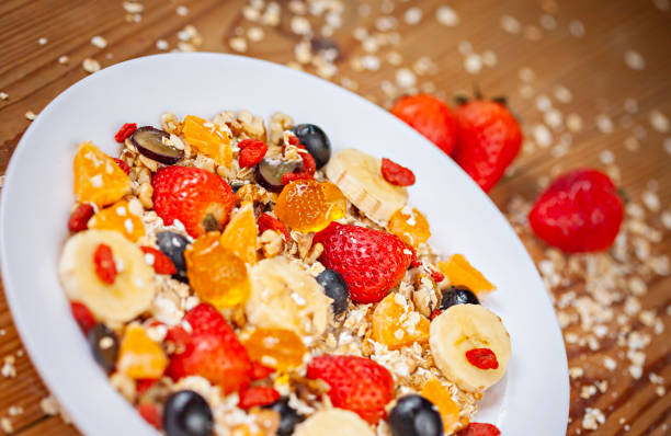 istock Healthy oats breakfast with mix fruits toppings. 1142547441