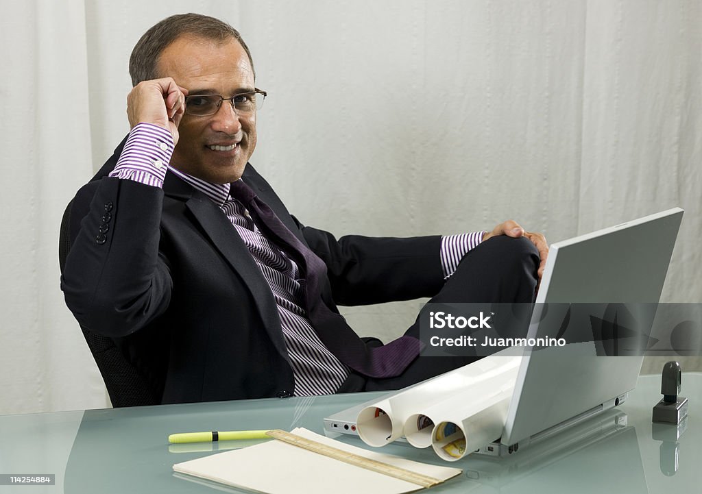 Executive adjusting his glasses  40-49 Years Stock Photo