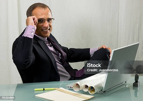 Executive Adjusting His Glasses Stock Photo - Download Image Now - 40-49 Years, Adjusting, Adult