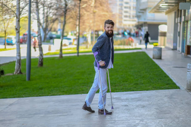 istock Young beautiful bearded man with walking sticks on the stree 1142549359
