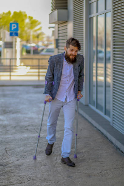 istock Young beautiful bearded man with walking sticks on the stree 1142550116