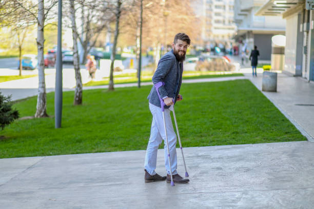istock Young beautiful bearded man with walking sticks on the stree 1142550743