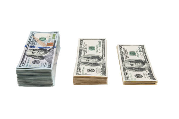 istock Bundle of US 100 dollars bank notes isolated on white background. 1142552057