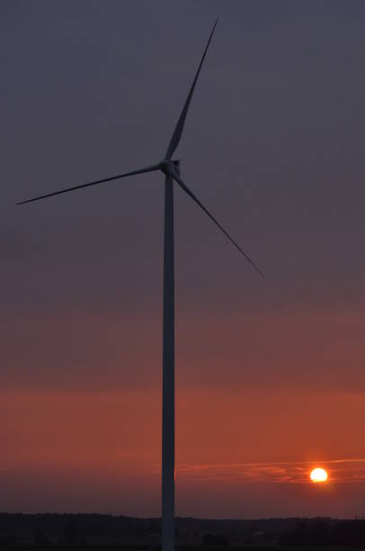 istock Windmill on the field. Production of energy from wind. Renewable resources. New technologies and design. 1142554331