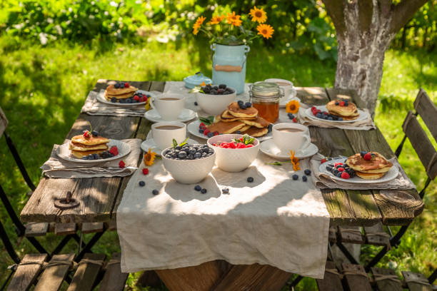 istock American pancakes for breakfast in sunny garden 1142557583