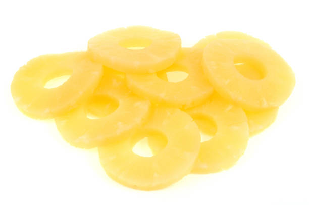 istock Pineapple cut into slices on a white background 1142558481