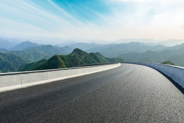 istock Asphalt road and mountains with beautiful clouds landscape 1142558564
