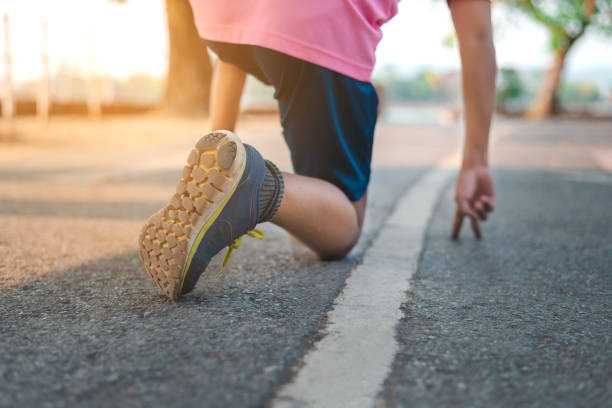 istock Man running on the park with Close up shoes 1142558594