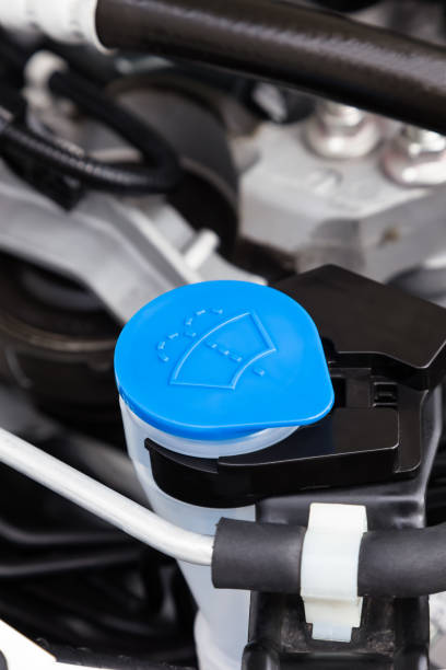 istock Car engine windshield washer fluid reservoir cap close-up 1142558776