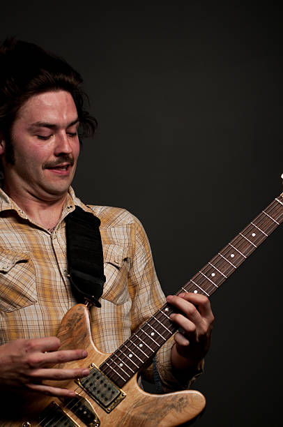 istock Guitarist in action portrait 114255916