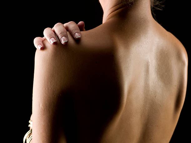 istock woman holding her shoulder 114255948