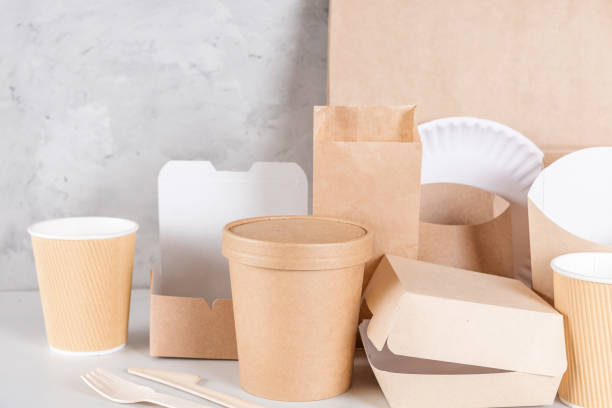 istock Eco friendly disposable tableware. Paper cups, dishes, bag, fast food containers and bamboo wooden cutlery 1142559593