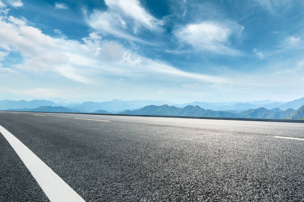 istock Asphalt road and mountains with beautiful clouds landscape 1142559888