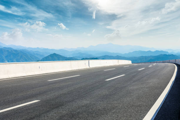istock Asphalt road and mountains with beautiful clouds landscape 1142559952