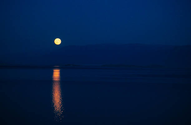 istock View of moon over water 1142559958