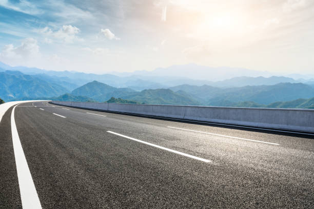 istock Asphalt road and mountains with beautiful clouds landscape 1142560723