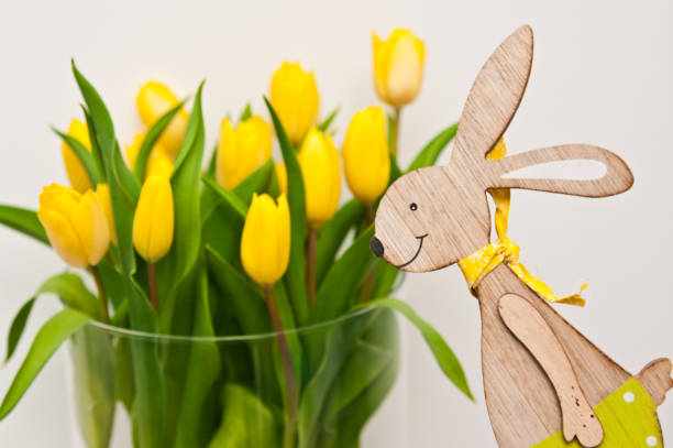 istock Yellow tulips in glass jar home decoration Easter concept 1142561887