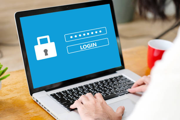 istock Hand tying laptop computer with password login on screen, cyber security concept 1142563339
