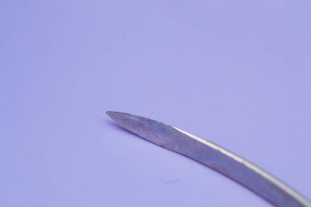 istock conventional cutting needle used in surgery on blue background 1142563563