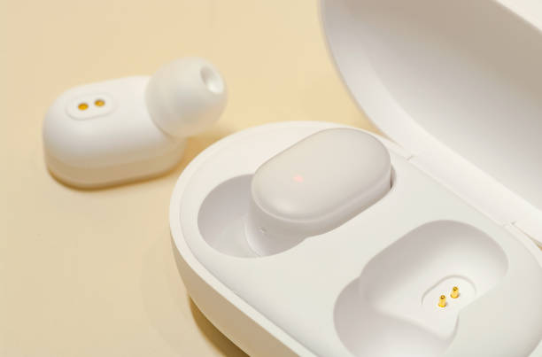 istock White earphones with power box. 1142563706
