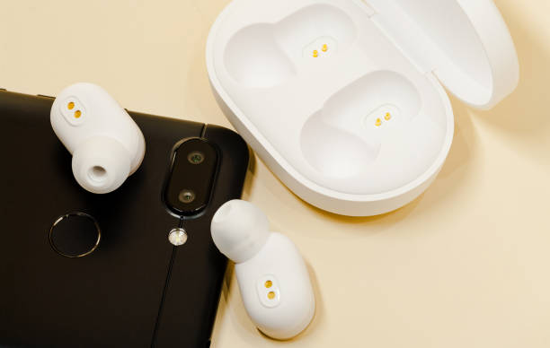 istock White earphones with smartphone. 1142563713