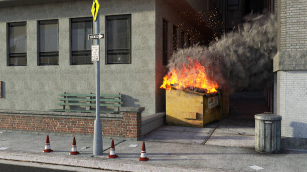 Burning rubbish bin in city Burning rubbish bin in city industrial garbage bin photos stock pictures, royalty-free photos & images